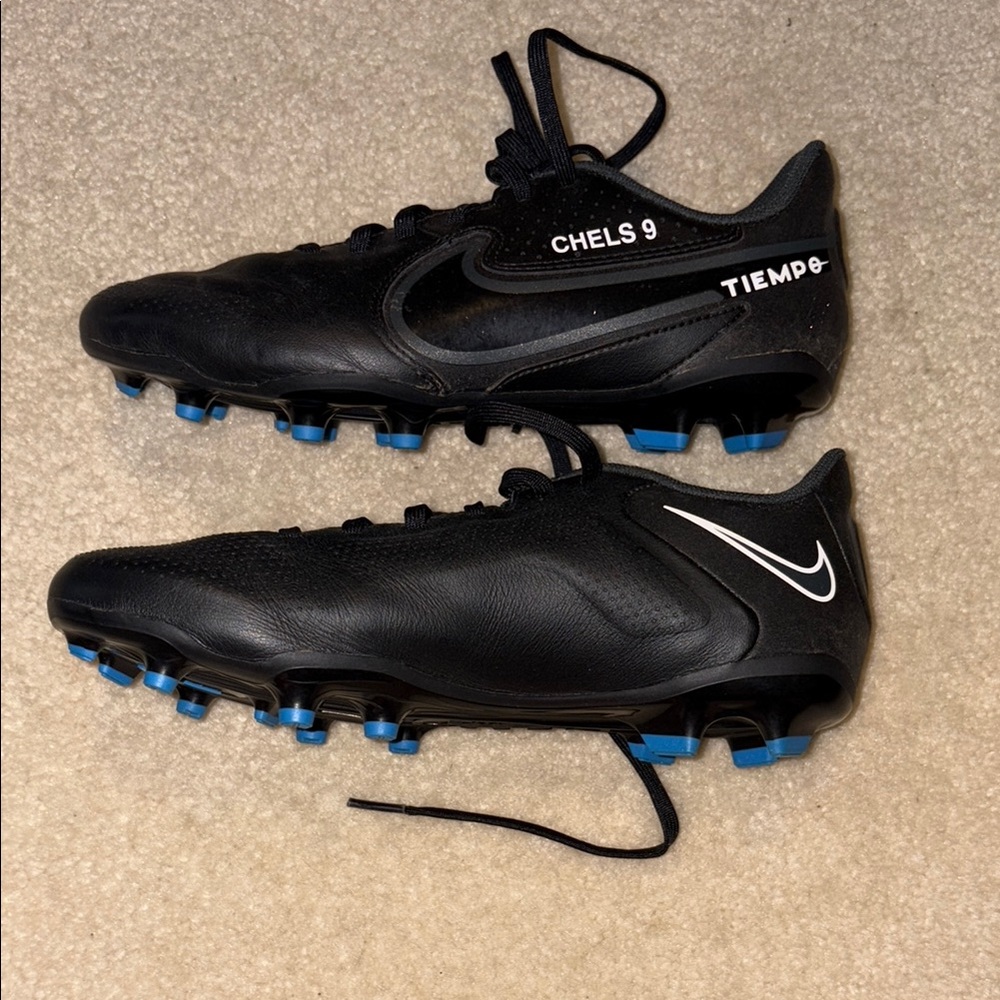 Nike Black and Blue Athletic Shoes with Firm Ground Cleats